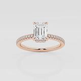 Emerald solitaire engagement ring with hidden diamond halo and pavé band in Rose Gold